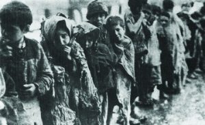 Photo of a Line of Orphans in Front of an Orphanage